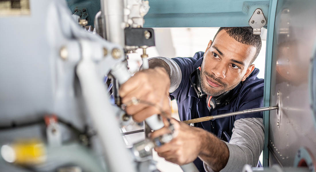 equipment repair professional working, seven benefits of planned equipment maintenance